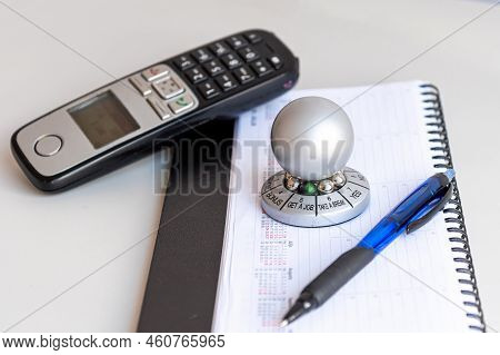 Table With Organizer, Phone And Wheel Of Opportunity, Pointer On Get A Job, Accidental Luck Concept