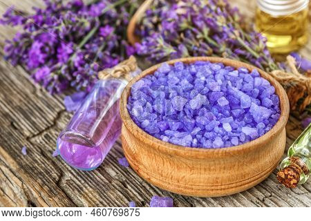 Lavender's Spa Products With Dried Lavender Flowers On A Wooden Table. Flat Lay Bath Salt And Massag
