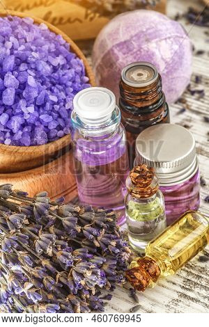 Lavender's Spa Products With Dried Lavender Flowers On A Wooden Table. Flat Lay Bath Salt And Massag