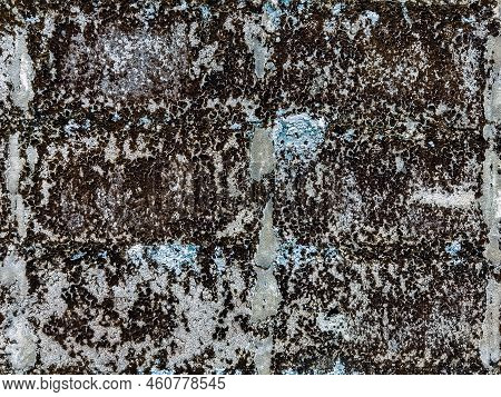 Dirty Old Eroded Cracked Plaster Cement Block Fence. Concrete Block Wall. Destroyed Crumbling Cement