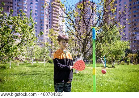Happy Boy Is Playing Tetherball Swing Ball Game In Summer Campin