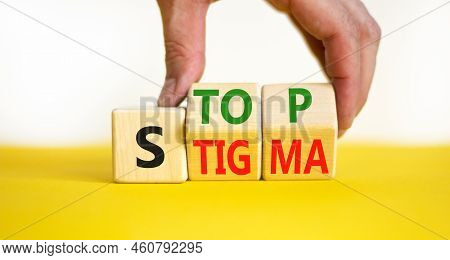 Stop Stigma Symbol. Concept Words Stop Stigma On Wooden Cubes. Businessman Hand. Beautiful Yellow Ta