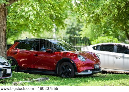 Chonburi Province, Thailand – 29 Jul 2022, Ora Red Car With Auspicious Number Was Parked Under The T
