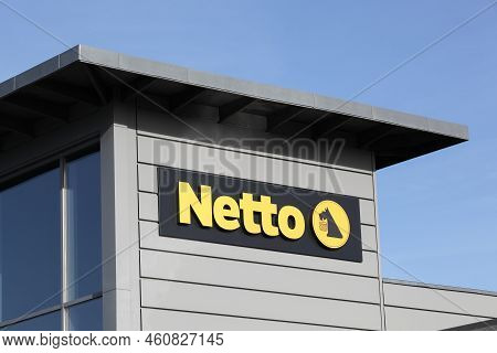 Odder, Denmark - October 22, 2021: Netto Sign On A Building. Netto Is A Danish Discount Supermarket 