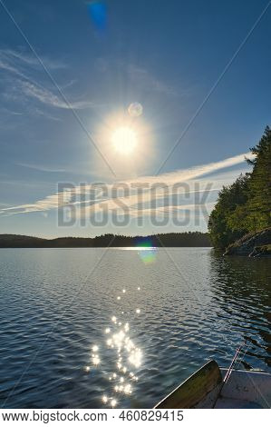 A Lake In Sweden In Smalland. Blue Water, Sunny Sky, Green Forests. Relaxation And Silence On Vacati