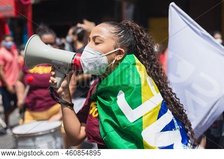 Protester Carries A Flag During A Demonstration Against President Jair Bolsonaro In The City Of Salv