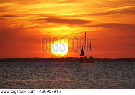 Silhouette Of The Yacht During Sunset Near Cape Henlopen State Park, Lewes, Delaware, U.s.a