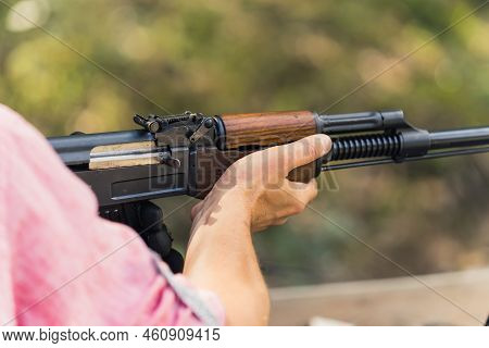 Hands Holding Rifle. Target Practice. Gun Training At Firing Range. Close-up Outdoor Horizontal Shot