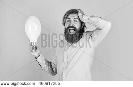 Oh My God. Innovation. Happy Bearded Man Holding Lamp Bulb. Creative Idea. Inspired With New Idea. M