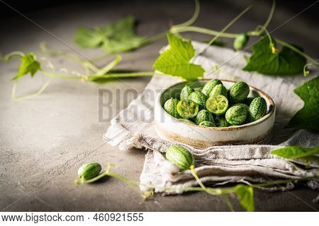 Cucamelon, Melothria Scabra In A Bowl. Organic Mouse Melon Fruits On Gray Background