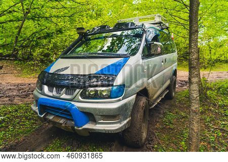05.11.2022 Okatse, Georgia - Shot Of A Minivan On Muddy Road In The Forest In The Spring, Okatse, Ge
