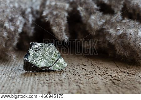 Piece Of Raw Polycrystalline Silicon, Polysilicon, Over Wooden Background