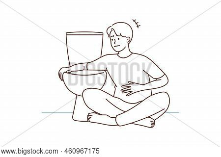 Unhealthy Man Sit Near Toilet Feeling Sick. Unwell Ill Guy Feel Nausea Want To Vomit In Wc. Healthca
