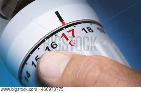 Man Setting Thermostat Temperature To 17 Degrees At Night. Composite Image Between A 3d Illustration