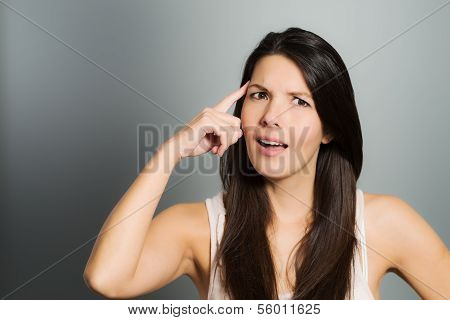 Young Woman Signaling With Her Index Finger