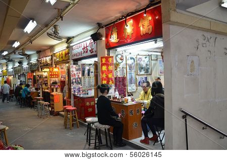 Fortune teller is serving his customers at Wong Tai Sin temple Hong Kong