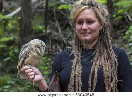 Woman Holds A Tame Owlet