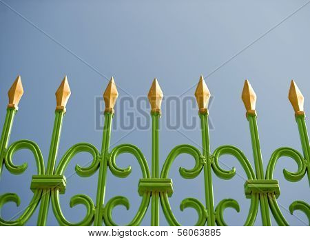 Green and gold spiked fench