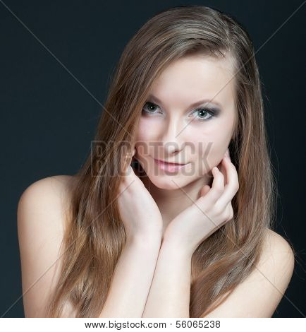 Fashion studio portrait of gorgeous young girl.
