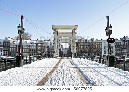 Snowy thiny bridge in Amsterdam the Netherlands in winter