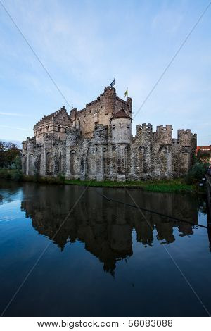 Gravensteen castle over pond, Ghent