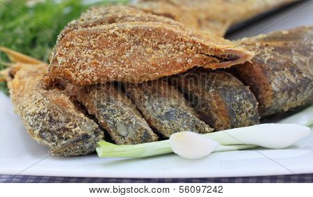 Closeup Of Uncooked Preserved Ilish Fish With Vegetables