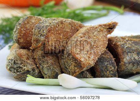 Closeup Of Uncooked Preserved Ilish Fish With Vegetables