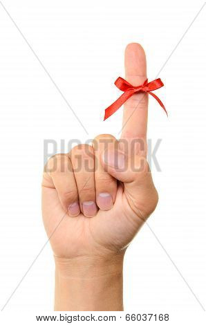 Red Bow On Finger