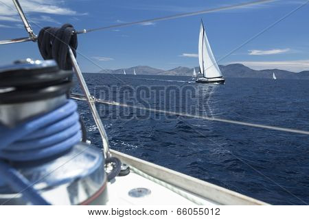 Winch with rope on sailing boat in the sea.
