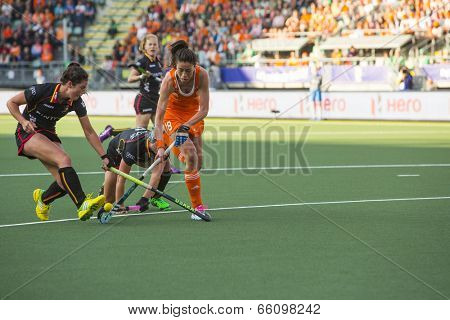 THE HAGUE, NETHERLANDS - JUNE 2: Dutch van As is passing the Belgium defense during the Hockey World Cup 2014 in the preliminary match between The Netherlands and Belgium (woman) NED beats BEL 4-0