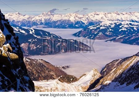 Foggy Zel am See valley from the top of Kaprun glacier in Austrian Alps