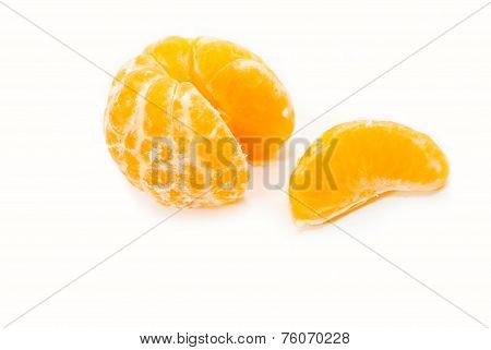 An Orange Slice Next To A Peeled Orange