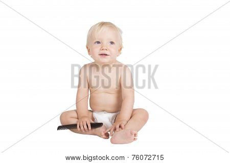 Young boy with black comb