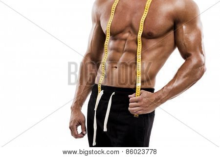 Muscle man posing with measuring tape, isolated over a white background