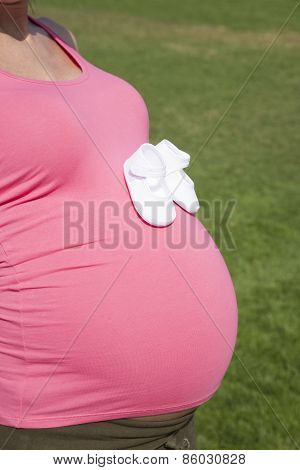 Bootees On Side Pregnant Tummy