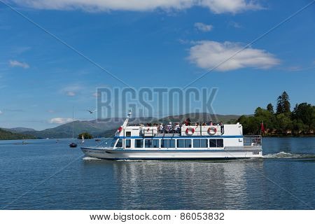 Bowness on Windermere Lake District England UK visitors enjoying tourist attractions like boat trips