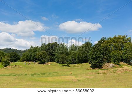 Bowness on Windermere Lake District England UK golfers enjoying tourist attractions such as mini gol