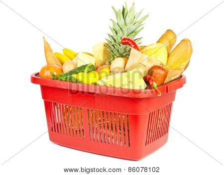 Many fuits and vegetables and other food in red shopping basket 