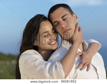 happy young romantic couple have fun relax smile at modern home outdoor terace balcony terace