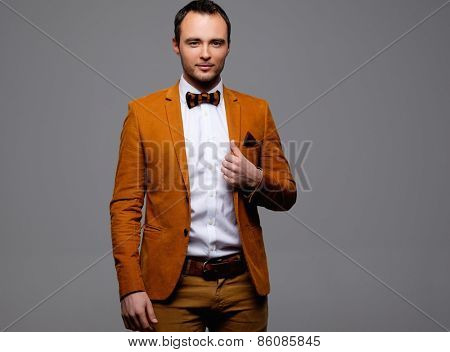 Sharp dressed fashionist wearing jacket and bow tie