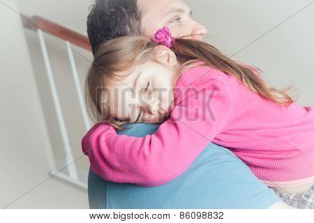 Litle Girl Sleeping In Dad's Arms