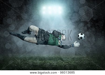 Soccer player with ball in action outdoors