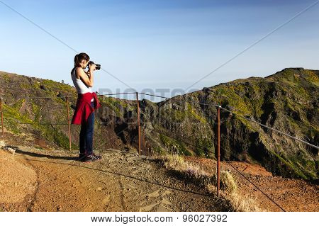 Young girl on the winding mountain trekking path at Pico do Areeiro, Madeira, Portugal