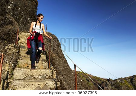 Young girl on the winding mountain trekking path at Pico do Areeiro, Madeira, Portugal