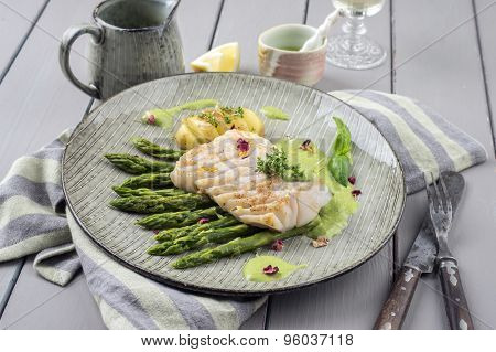 saithe fillet with green asparagus