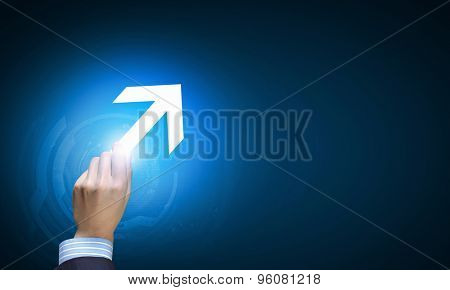 Close up of huma hand with arrow icon