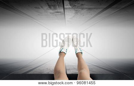 Woman standing on the edge of the roof
