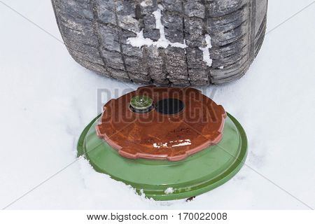 The car runs into a Soviet tank-stopping mine set in the snow
