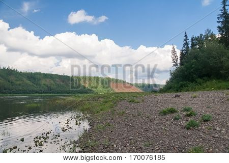 The sandy bank of the river. Affluent of Yenisey river. Krasnoyarsk Territory.