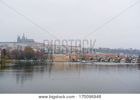 Prague,  Czechia - November, 24, 2016: Panorama of an old Prague, bridges and embankment of Vitava river, Czechia